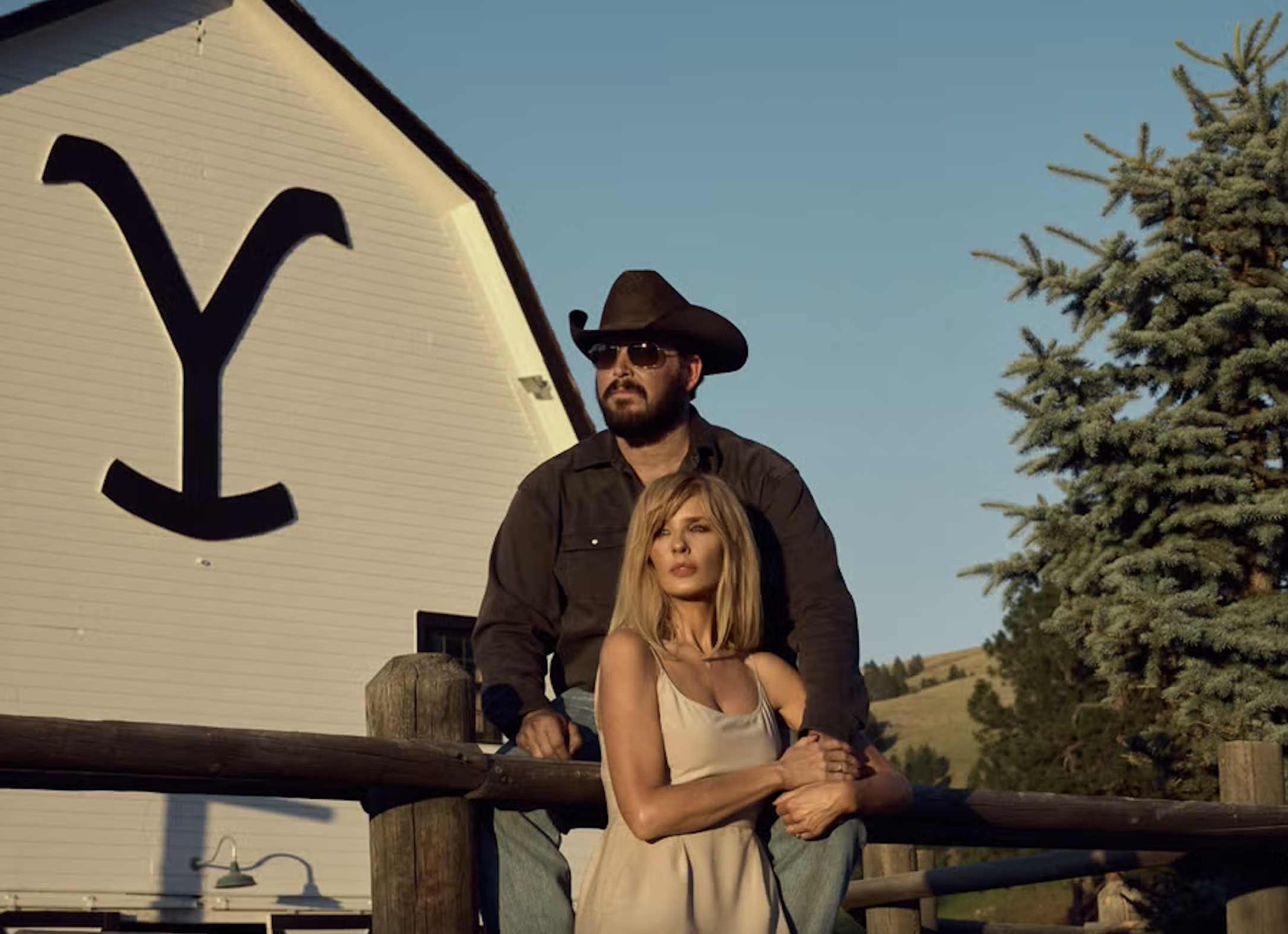 yellowstone season 5 part 2 rip and beth in front of the yellowstone ranch barn 